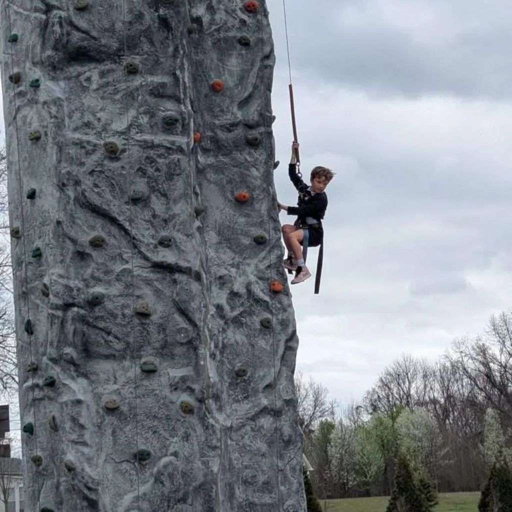 Rock wall climbing attraction at Atoka Railroad Adventure